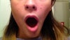 Mouth open as far as it will go.