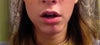 Mouth slightly open.