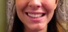 Smiling.