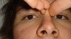 When I pinch the top of my nose, they fade away