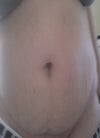front view of my tummy, notice the pooch and the sagging skin and stretch marks.