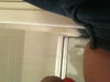 Tummy jelly roll over top of jeans, photo taken sitting down.