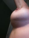 arm raised on right breast