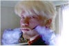 This is from a movie, the cigarette smoke is coming from his cheeks where it has been cut open.