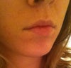 I find that when I'm not smiling at all, my lips curl back under and appear smaller. Also my philtrum is rather large.
