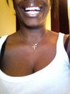 Here you can see in a very wide smile, Its appears I have a missing tooth in the back, but in fact the implant and crown on both sides are matched up. However, One crown is clearly bigger then the other.