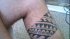The tattoo wraps around the back just a little bit. About 1 cm is cut out in the picture.
