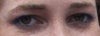 smiling, with eye makeup. no flash