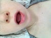 No teeth showing.
