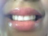 Smiling very widely and I have to force my lip up to see the teeth