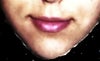 This is the same picture as the second one, but I've photoshopped the upper lip to show what i'd like it to look like.  As you can see, the change is not very drastic (in my opinion).  I would really just like for my upper lip to not disappear.  I don't need it to be pouty or anything like that.