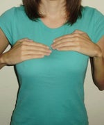 My hands are resting on the tops of each implant.