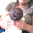 Sorry for the blurry pic. Me holding my grand baby 1 year earlier.