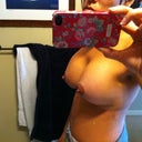 you can see my left breast with the black towel right behind it and how it is flat on the top half above the nipple