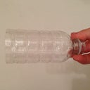 Here's my little pee funnel. I cut off the bottom of this mini bottle and hold it against myself. Keeps the pee from splashing over your garment. I rinse if out between each use
