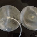 another picture of explanted implants.   One had a tube attached to it.  I am guessing that is the one that was still full and it was used to drain it.   My PS said the other one was totally deflated and their was no visible hole so it much be really small or around the valve.   They both came in sealed packages since they had been sterilized I opened them so I could see them better.