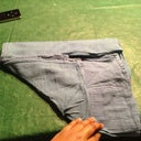 Step 6: On the side with the folded piece take the left corner and fold it up so that the point meets the center of your now square (refer to picture)