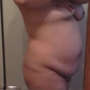 side view of hanging belly (tried covering my girls up but one still managed to pop out oops sorry)