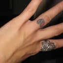 Before: originally tattooed in black outline with red color, then filled in with black a few months later to try to "improve" the look; clearly that failed.