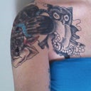 Here is the nightmare. The old tat is under the owls wing and black blobs that were going to be flowers. This was two weeks after first session of part on the arm.
