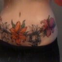 color added to three flowers and leaves from side.
