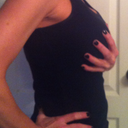 The 34DD bra with rice and a tank top over.  It's hard to gage size in the pics so I held one breast to have something to gauge size with.