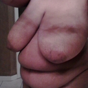 Body shot...Triple D breasts, and big stomach..lol....what a combo