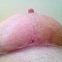 Right underboob.  Sticky side OUT, you MORON!!!!