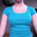 With two bras on - to help adjust mind for sizing.