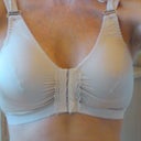 Here is the 2nd Day Post-Opt photo. On my right breast there is a lot of fluid built-up. I believe because my left one was slightly lower than the right he adjusted the pocket on my right so it's angry right now. It's very puffy on the sides and has migrated around to my back around the bra area. Very tender to the touch. I am also very spongey, swollen inbetween so it's kinda flattened them out so I don't have too much cleavage.