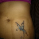 This is a month after my first session (July 2nd). I am not covering it anymore and as you can see from the pics, the tape really irritated my skin, that explains the "square" around the tattoo.