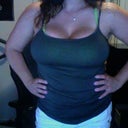 Tank top pic w that same little spots bra- 7 months after surge-- 640cc & 660 cc High profile implants Sub glandular (about muscle) Scar is under my breast.