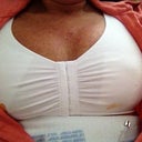 Me laying down in my sports bra PO day 2.. Te girls are very swollen right now but I am please