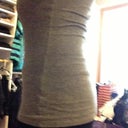 7 months PO. Left side view in tank top. Pretty flat.
