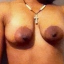 Boobs prior to surgery with LARGE areolas, now looking at them...they were not even...or maybe that's how I was standing.