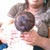Sorry for the blurry pic. Me holding my grand baby 1 year earlier.