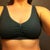Before, front view in a sports bra