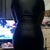 in a body shaper dress and belly trimmer (from back)