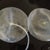 another picture of explanted implants.   One had a tube attached to it.  I am guessing that is the one that was still full and it was used to drain it.   My PS said the other one was totally deflated and their was no visible hole so it much be really small or around the valve.   They both came in sealed packages since they had been sterilized I opened them so I could see them better.