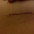 Extreme close up of me holding up the scar - 8 weeks