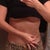Me pinching fat on the right side of my body. Notice the large difference between this and the last picture.