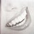 My favorite shape of teeth look like this.  When mine are straighten by Invisalign, I complete the dental implants.  I will bond my front teeth to look like this!