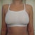 25 Days - Wearing bras 24 hours a day and this is currently my bra of choice.  I switch off with standard compression sports bras but I like this one because it lays better under clothes.  Barely There Bandini without foam bought at Target.  Would not suggest for anyone left with a large chest though.  Tight fitting but not very supportive.