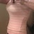 Invisible under even light and form fitting clothes. It is a good buy. It shipped quickly and there is no issue with my return and exchange for a different size, I am pleased with the quality and the company in general. Cant wait for the Medium so I can wear it 24/7.