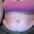 belly sitting down