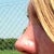 Tip to high and nostrils visible from the front