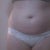 From the front my tummy looks like I have a few extra pounds, but when I sit down my tummy eats my underwear. Also when I wear clothes my tummy pouch is much more noticeable.